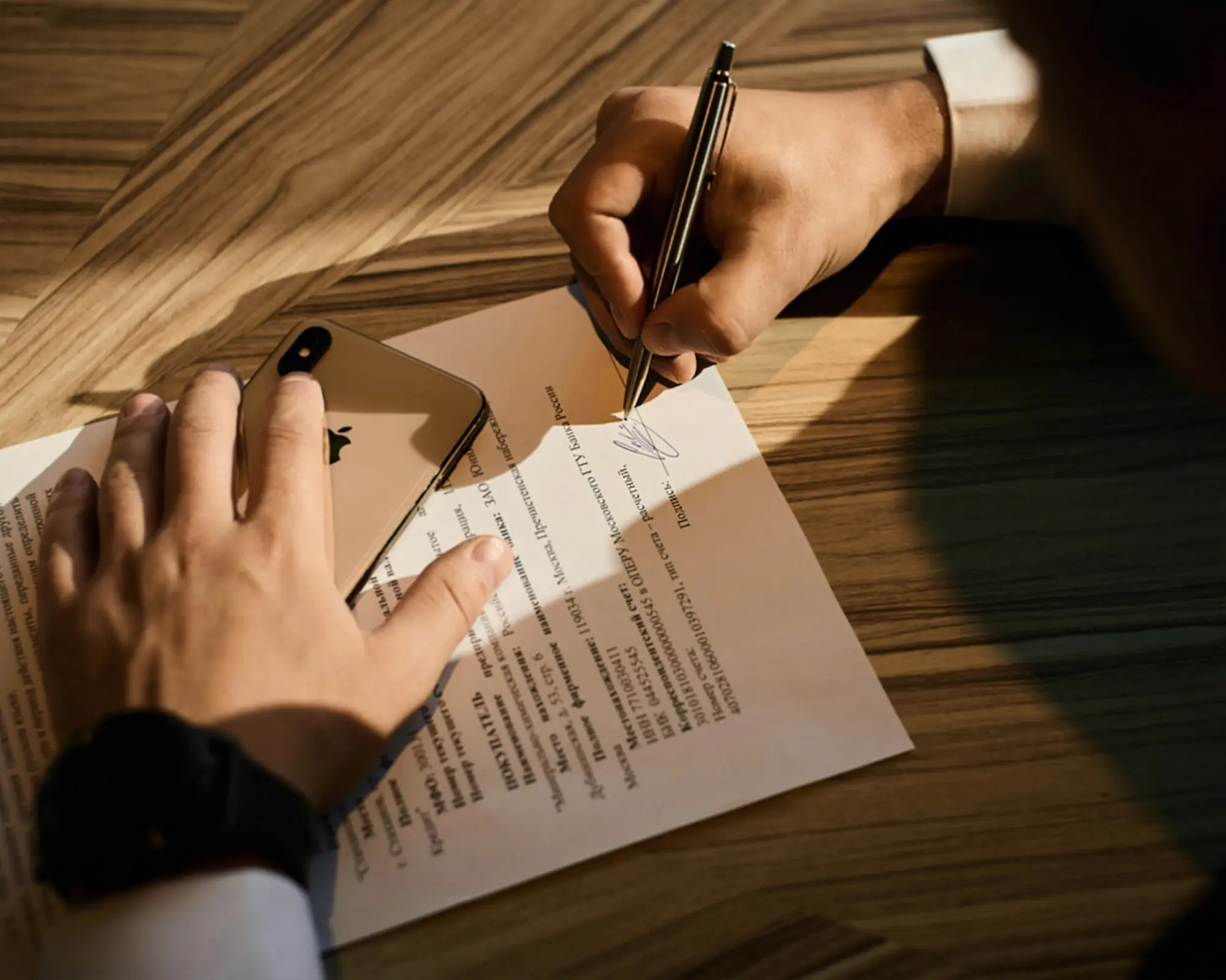 A client signing a legal agreement